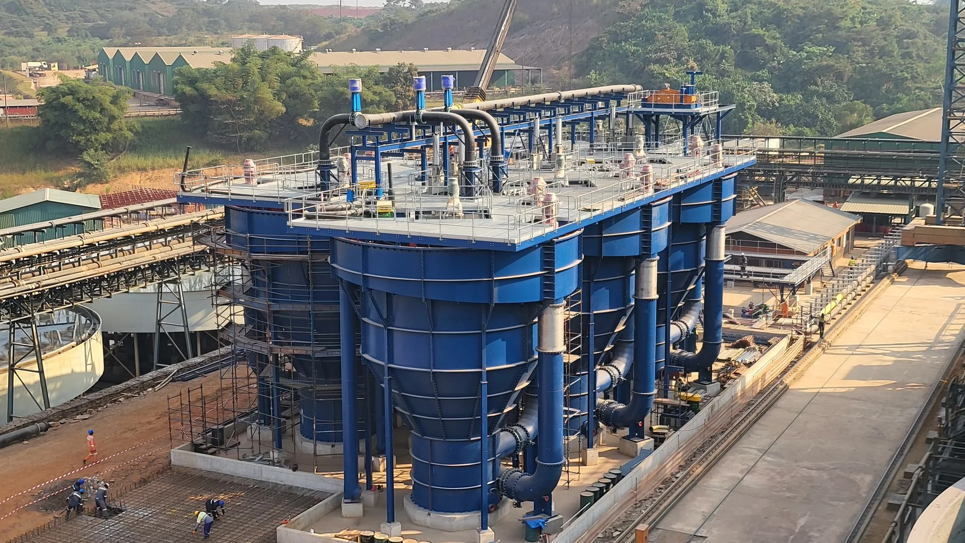 A completed AZTEC UpFlow Reactor installation within a gold processing plant, with access platforms and connecting pipework