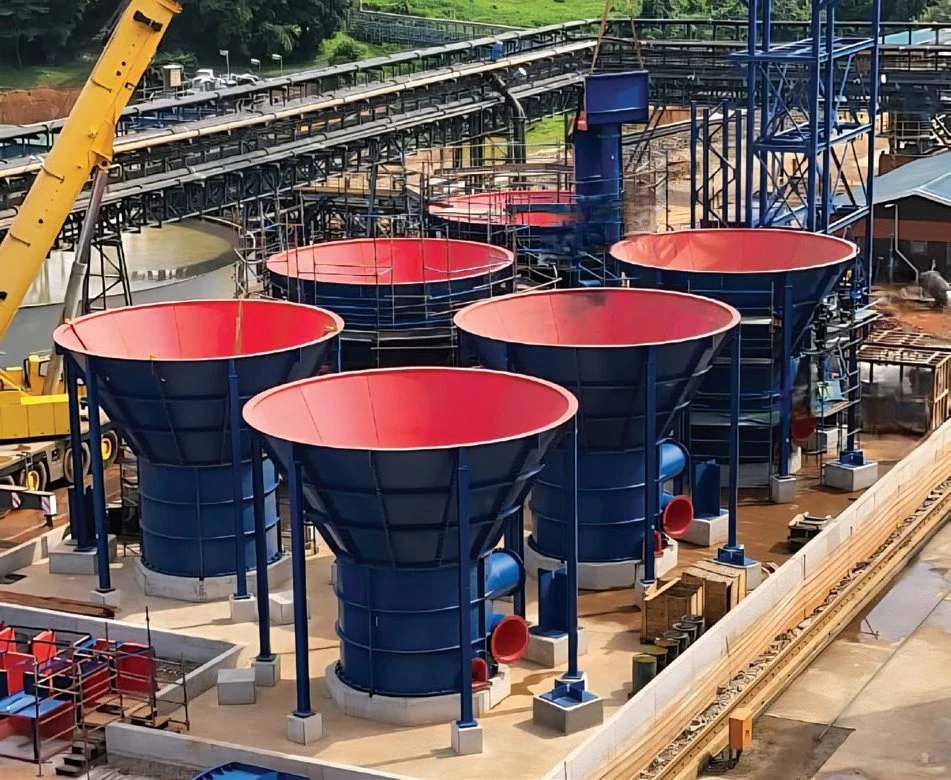 Six AZTEC UpFlow Reactor vessels during construction, showing the wide conical mouths narrowing to a base outlet