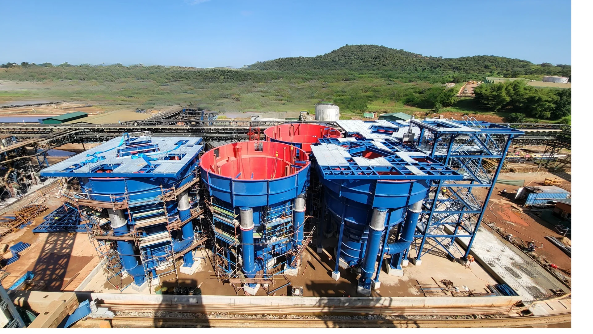 Aerial view of three AZTEC UpFlow Reactor vessels during installation, showing the open conical vessel interiors